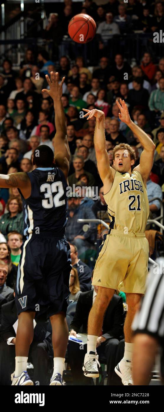 Notre Dame forward Tim Abromaitis, right, puts up a shot over Villanova