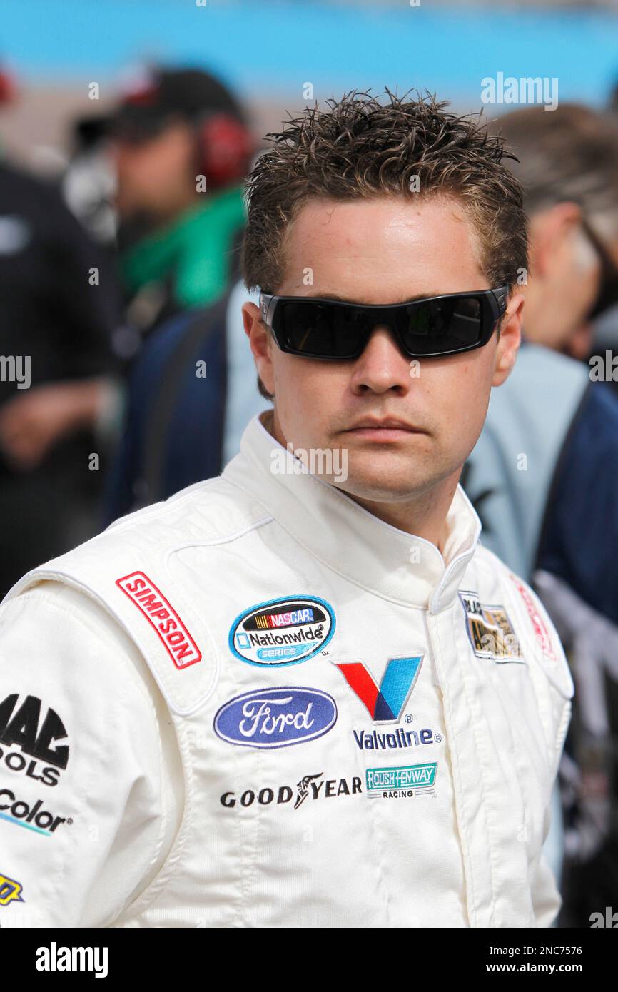 Driver Ricky Stenhouse, Jr., stands by his car prior to qualifying for ...