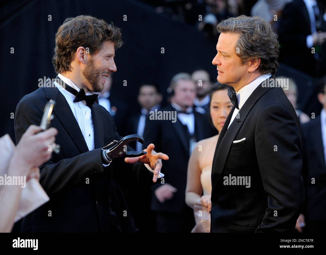 Aaron Lee Ralston, left, talks with actor Colin Firth as they arrive ...