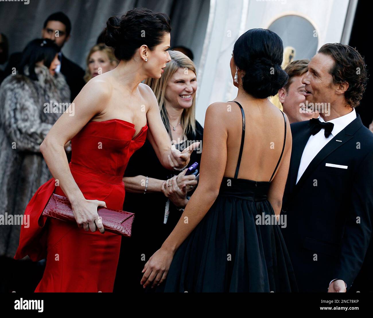Actress Sandra Bullock, left, shares a laugh with actor Matthew
