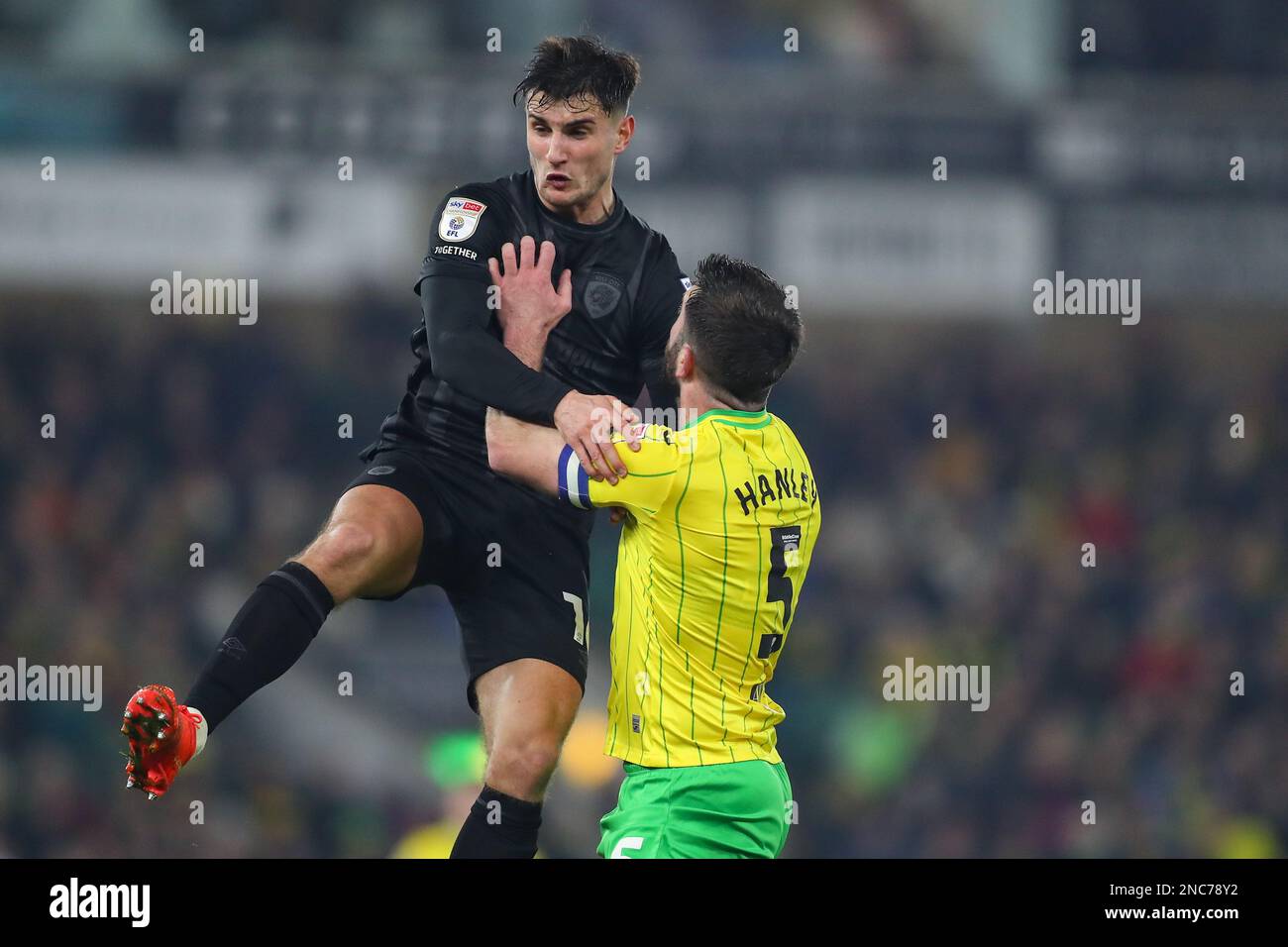 Ryan Longman #16 of Hull City and Grant Hanley #5 of Noriwch City battle for the ball during the Sky Bet Championship match Norwich City vs Hull City at Carrow Road, Norwich, United Kingdom, 14th February 2023  (Photo by Gareth Evans/News Images) Stock Photo