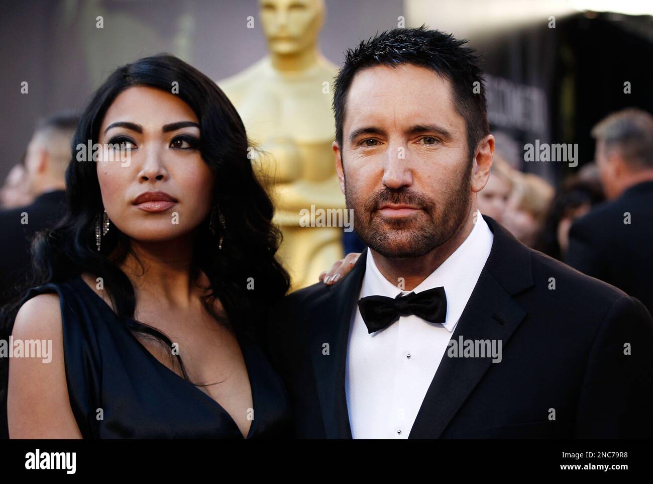 Composer Trent Reznor, right, arrives with his wife Mariqueen Maandig before the 83rd Academy