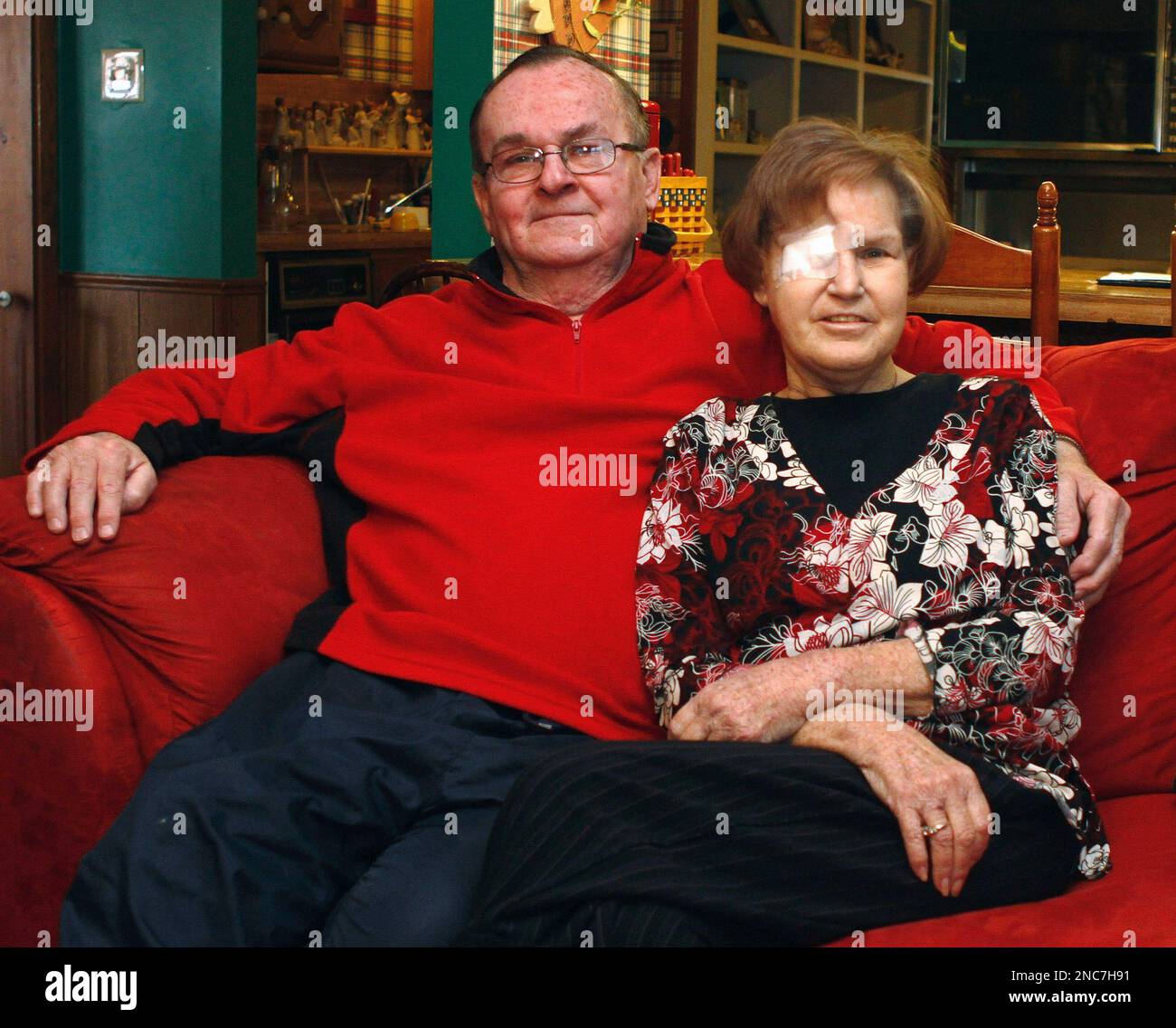 Bob Niles, left, and his wife Karen Niles, right, pose for a photo in