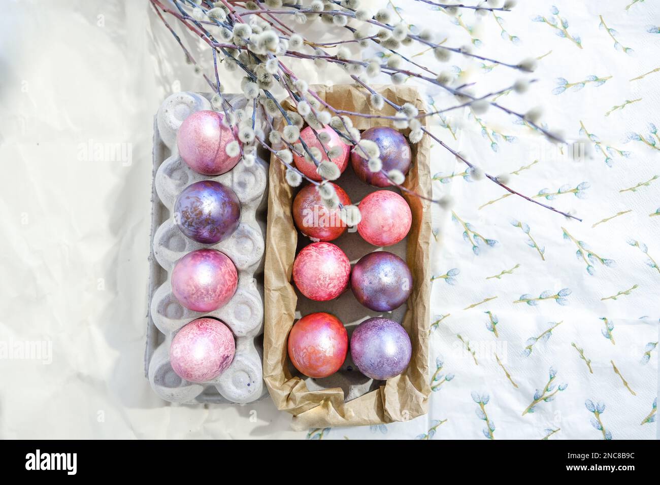 Easter eggs and willow branches on light background Stock Photo - Alamy
