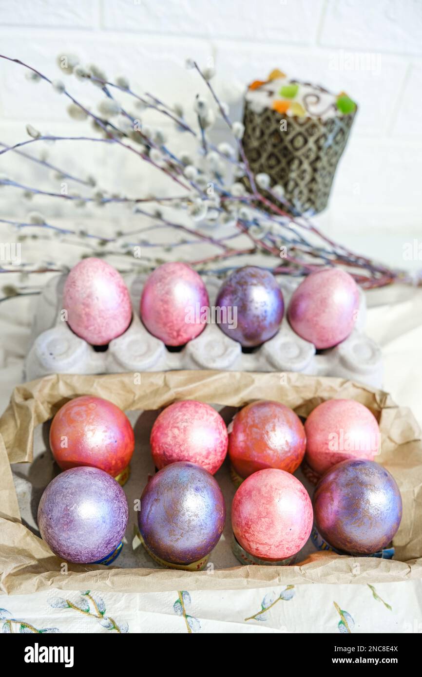 Easter eggs and willow branches on light background Stock Photo - Alamy