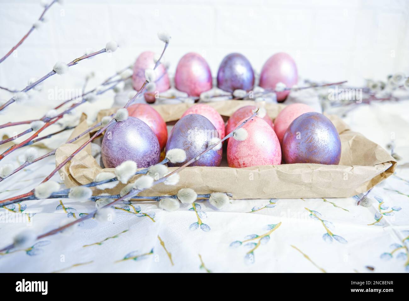 Easter eggs and willow branches on light background Stock Photo - Alamy