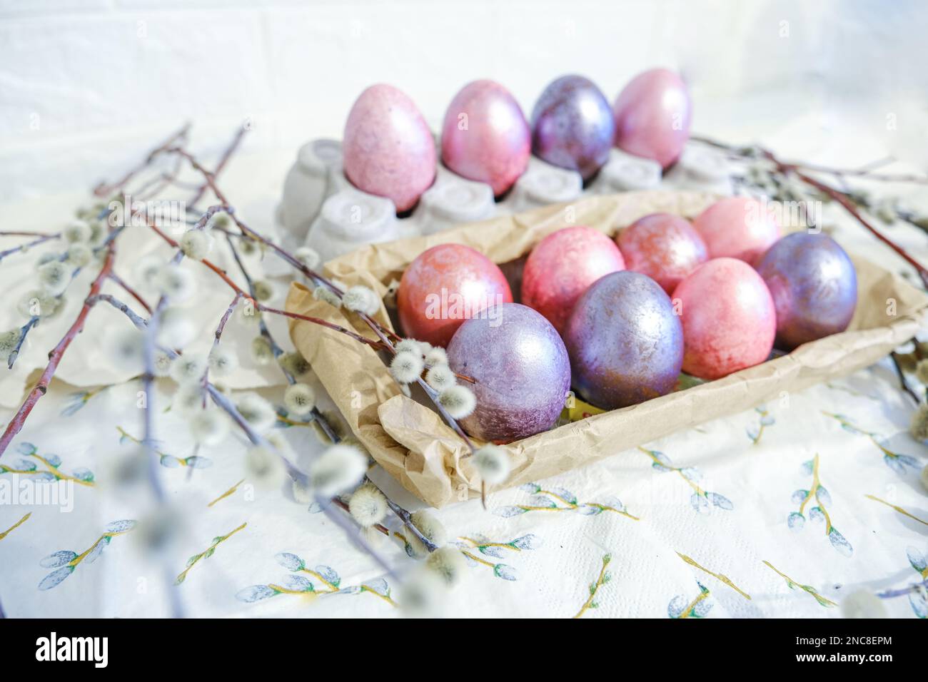 Easter eggs and willow branches on light background Stock Photo - Alamy