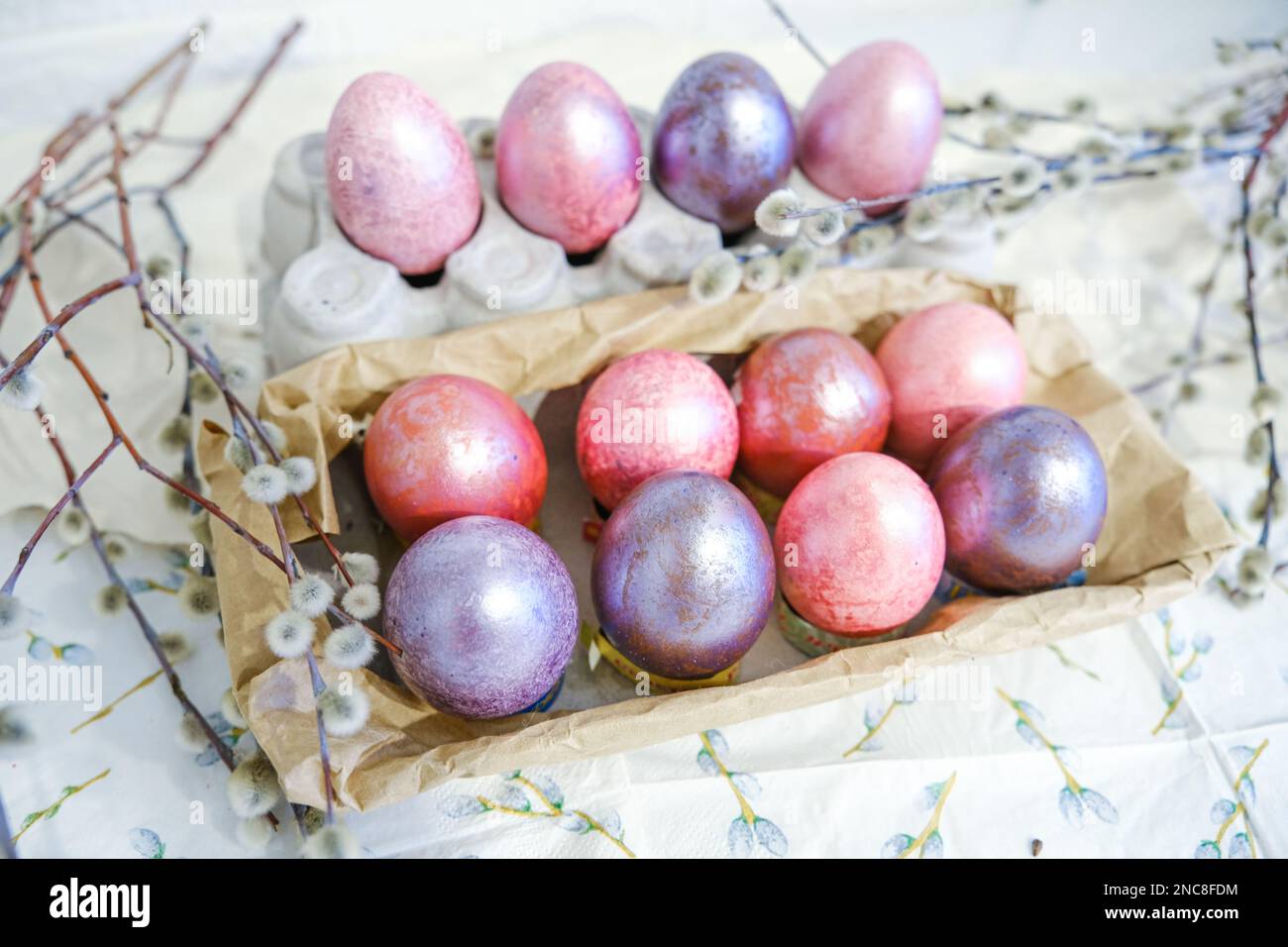 Easter eggs and willow branches on light background Stock Photo - Alamy