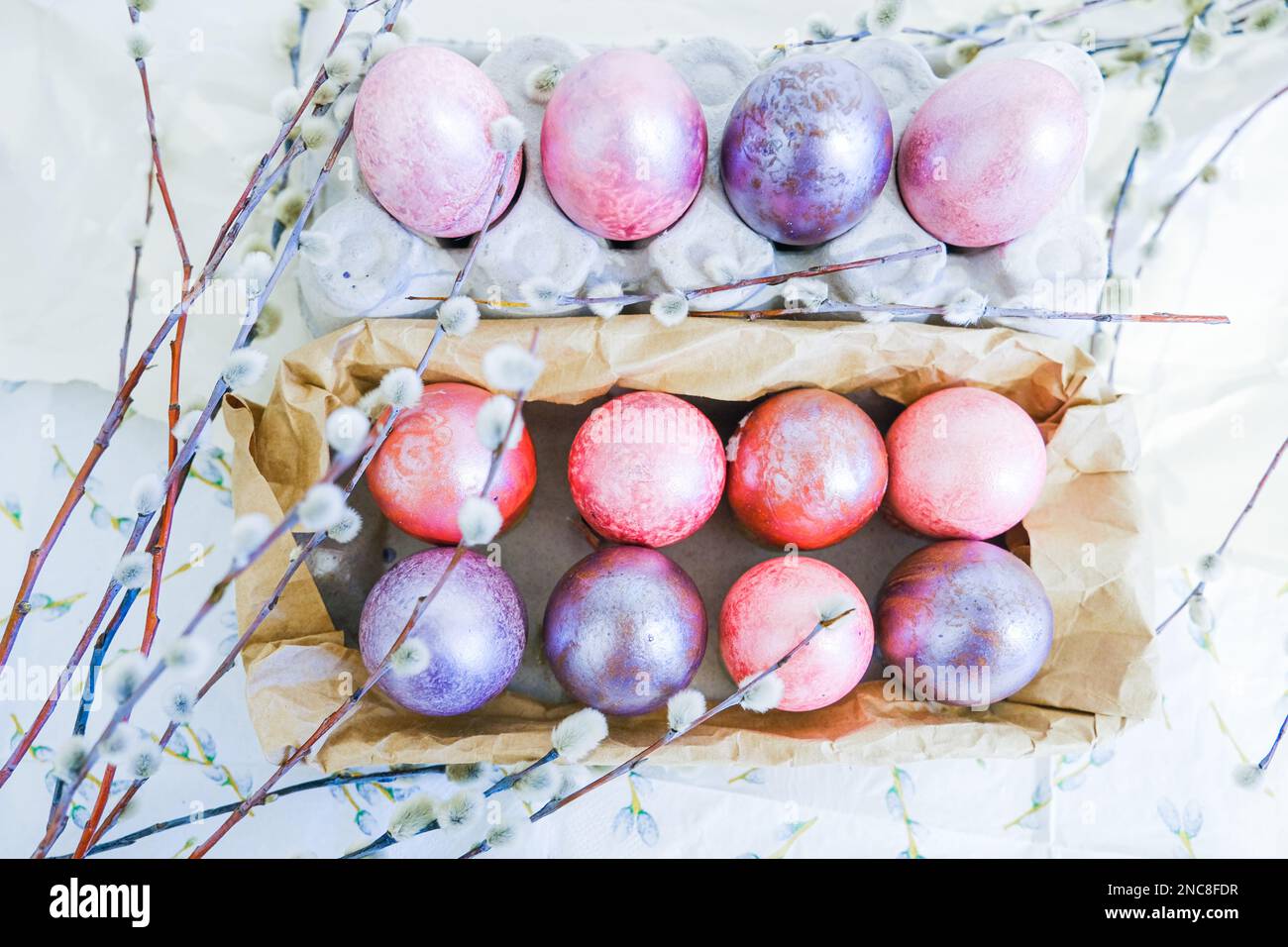 Easter eggs and willow branches on light background Stock Photo - Alamy