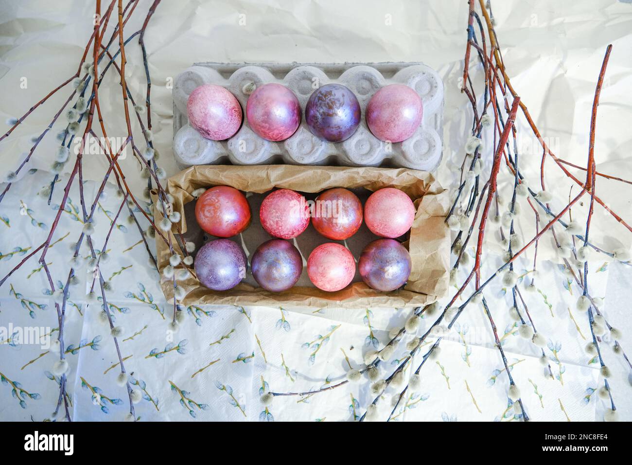 Easter eggs and willow branches on light background Stock Photo - Alamy