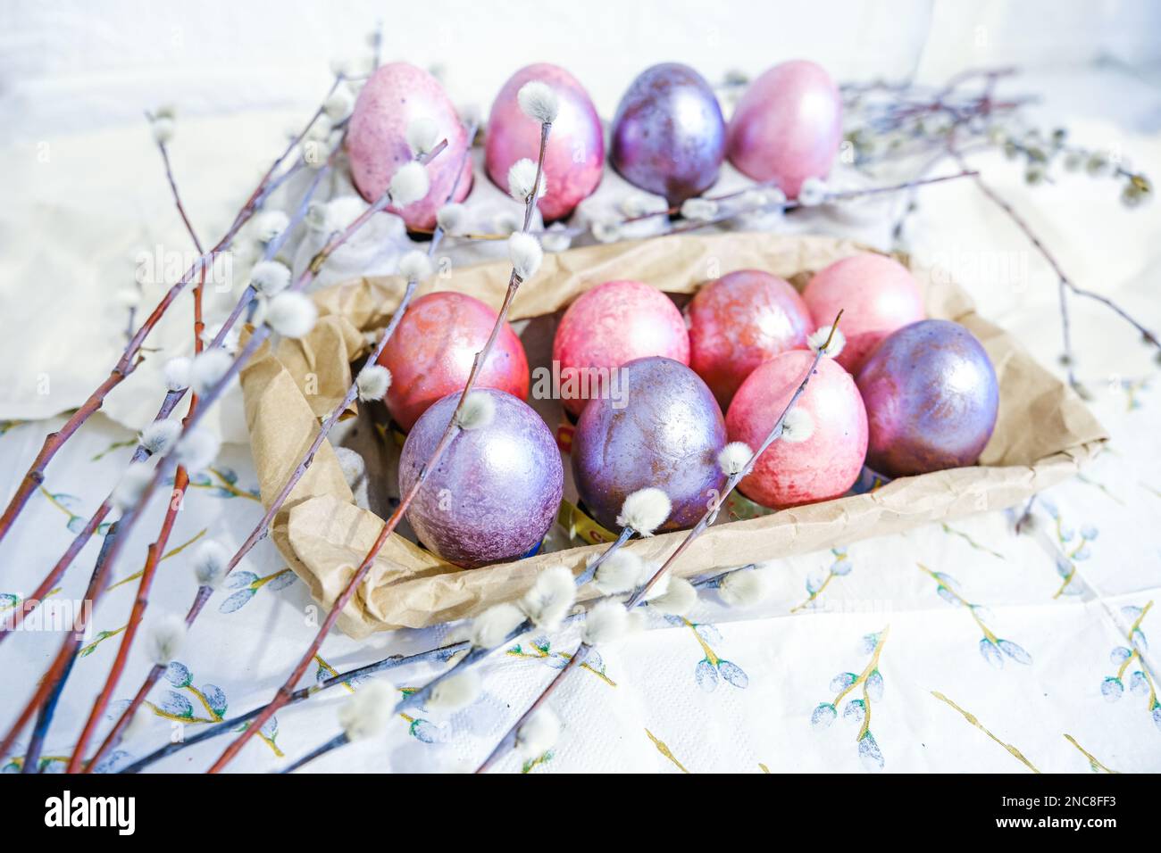 Easter eggs and willow branches on light background Stock Photo - Alamy