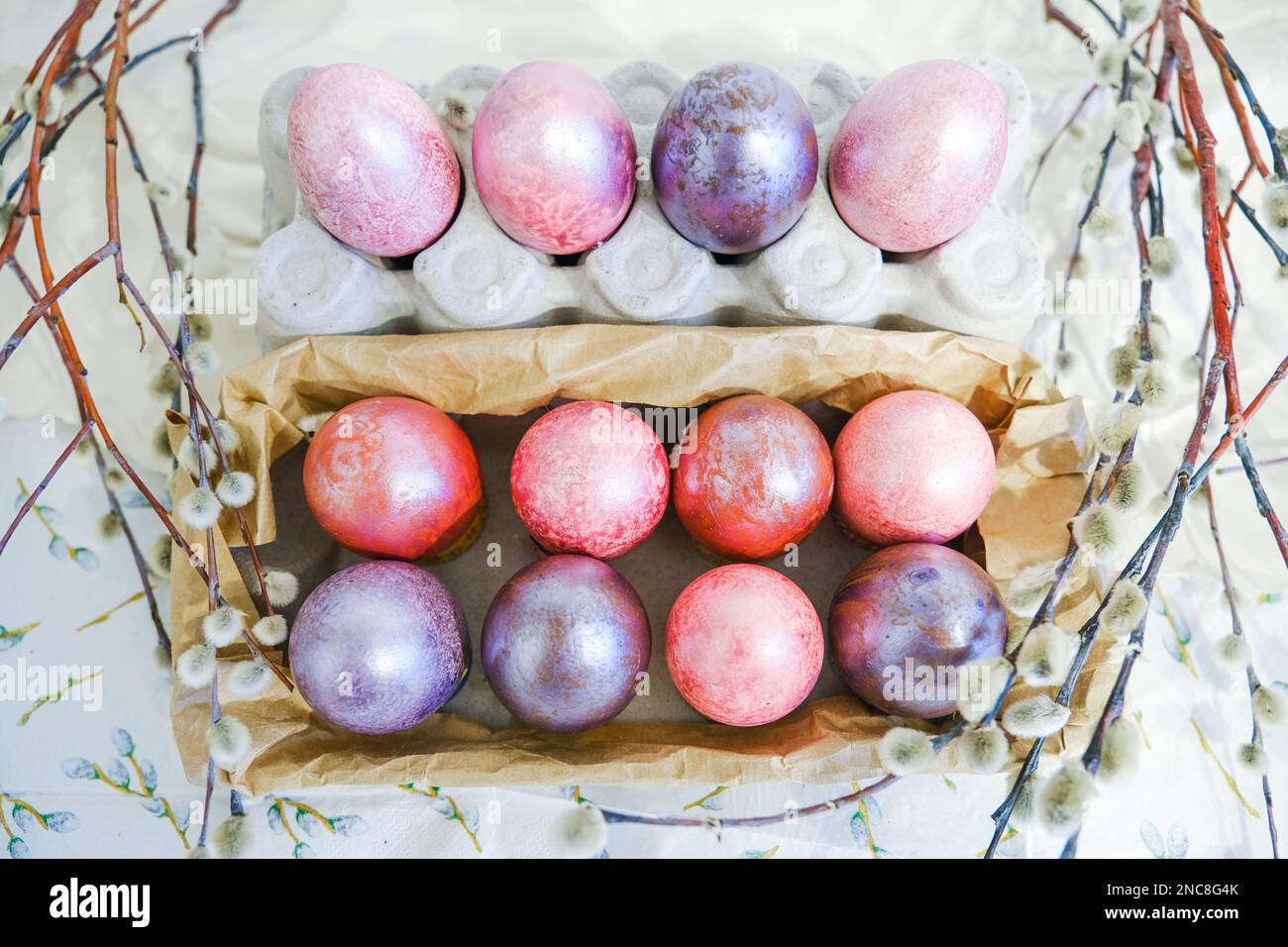 Easter eggs and willow branches on light background Stock Photo - Alamy