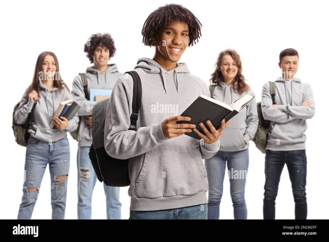 African american male student holding a book and a group of caucasian ...