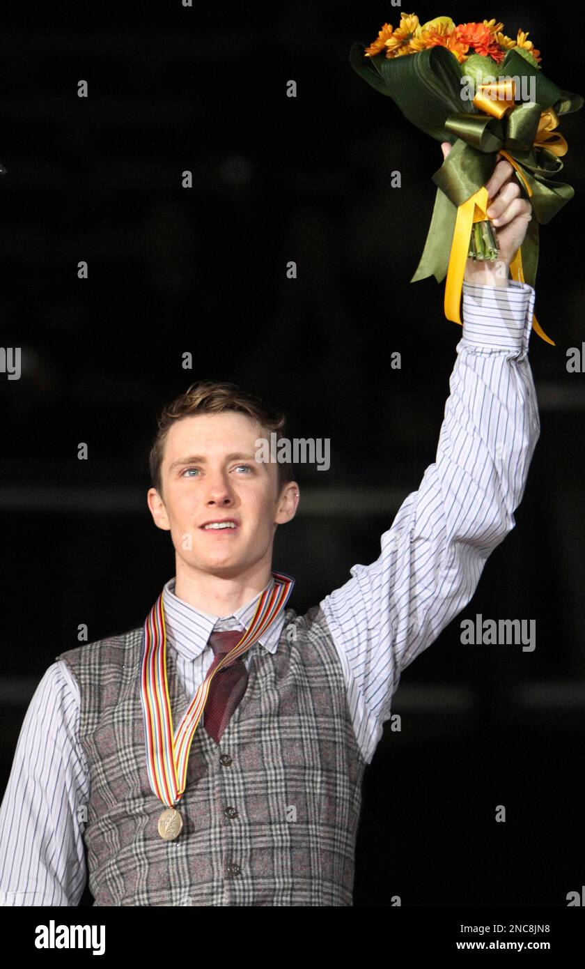 Men's bronze medal winner USA's Jeremy Abbott waves a bouquet of