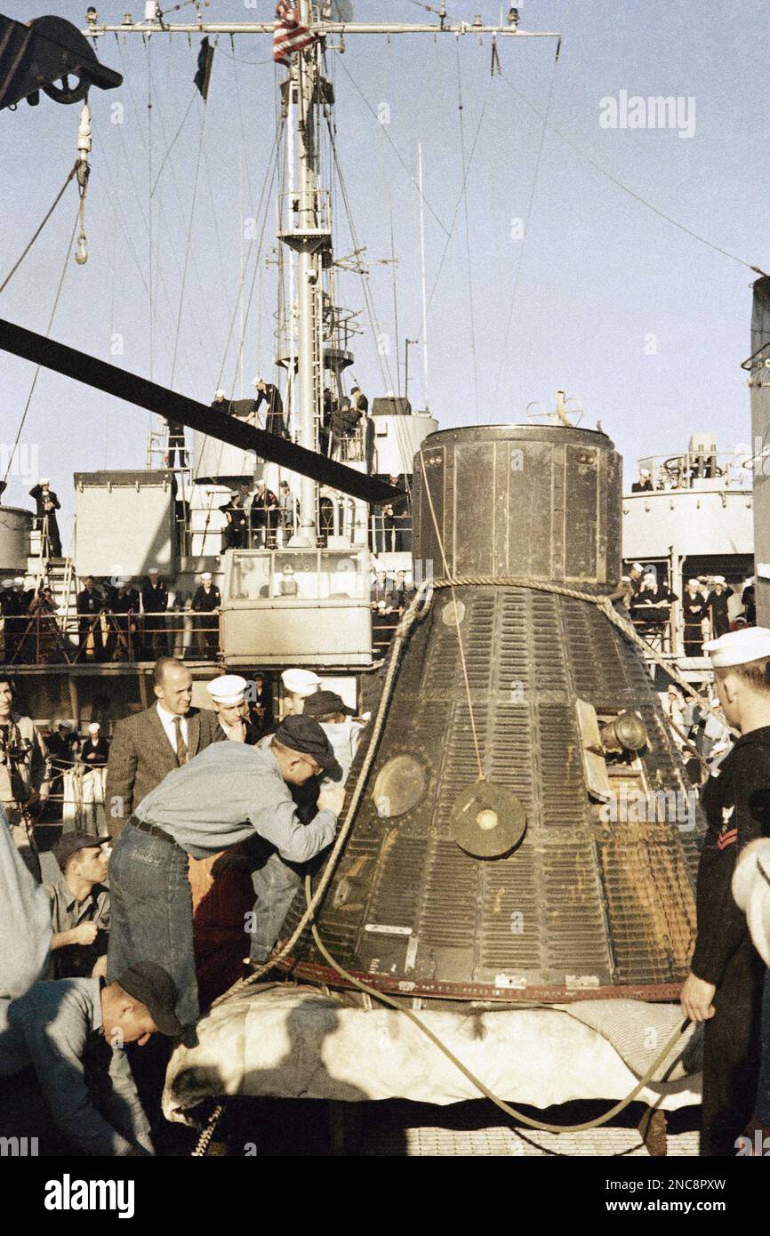 Ham, a chimpanzee, is inside the rocket shown on deck of ship after ...