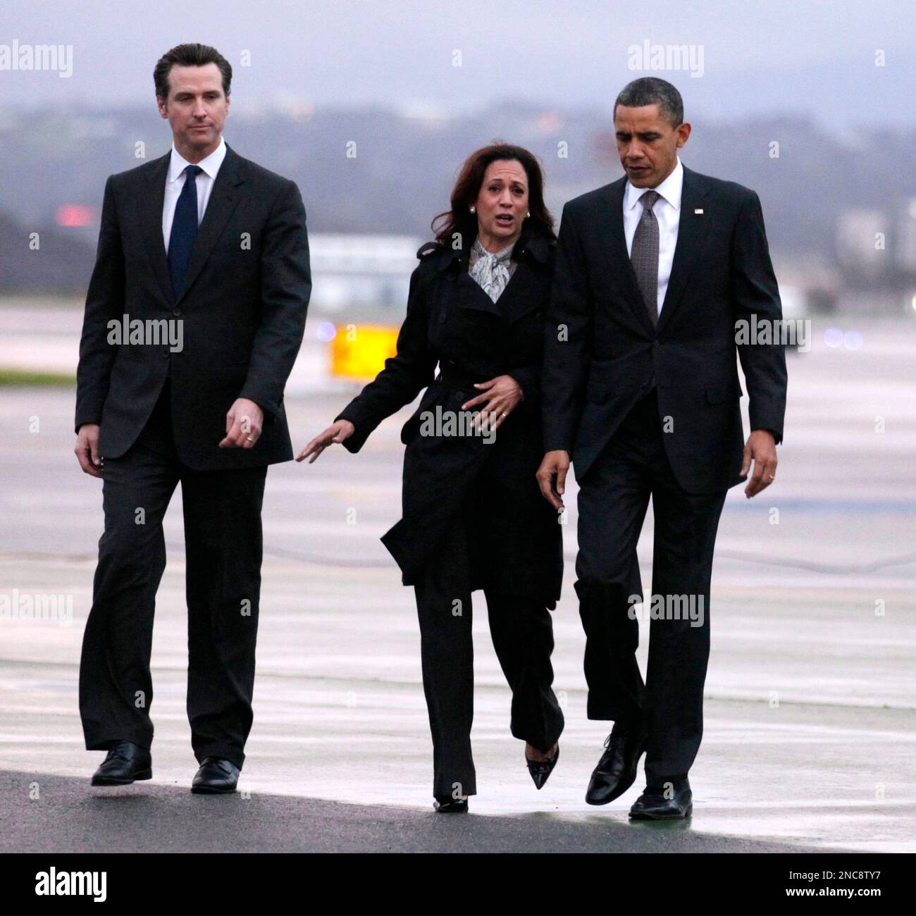 President Barack Obama walks along the tarmac with California Attorney  General Kamala Harris, center and Lt. Gov. Gavin Newsom, left, after Obama  arrived on Air Force One, Thursday, Feb. 17, 2011, in, image size:1300x1300