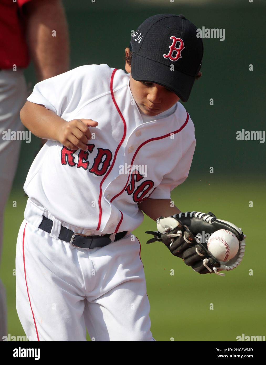D'Angelo Ortiz, 6, son of Boston Red Sox designated hitter David Ortiz,  makes a good catch during spring training baseball in Fort Myers, Fla.,  Thursday, Feb. 17, 2011. (AP Photo/Dave Martin Stock