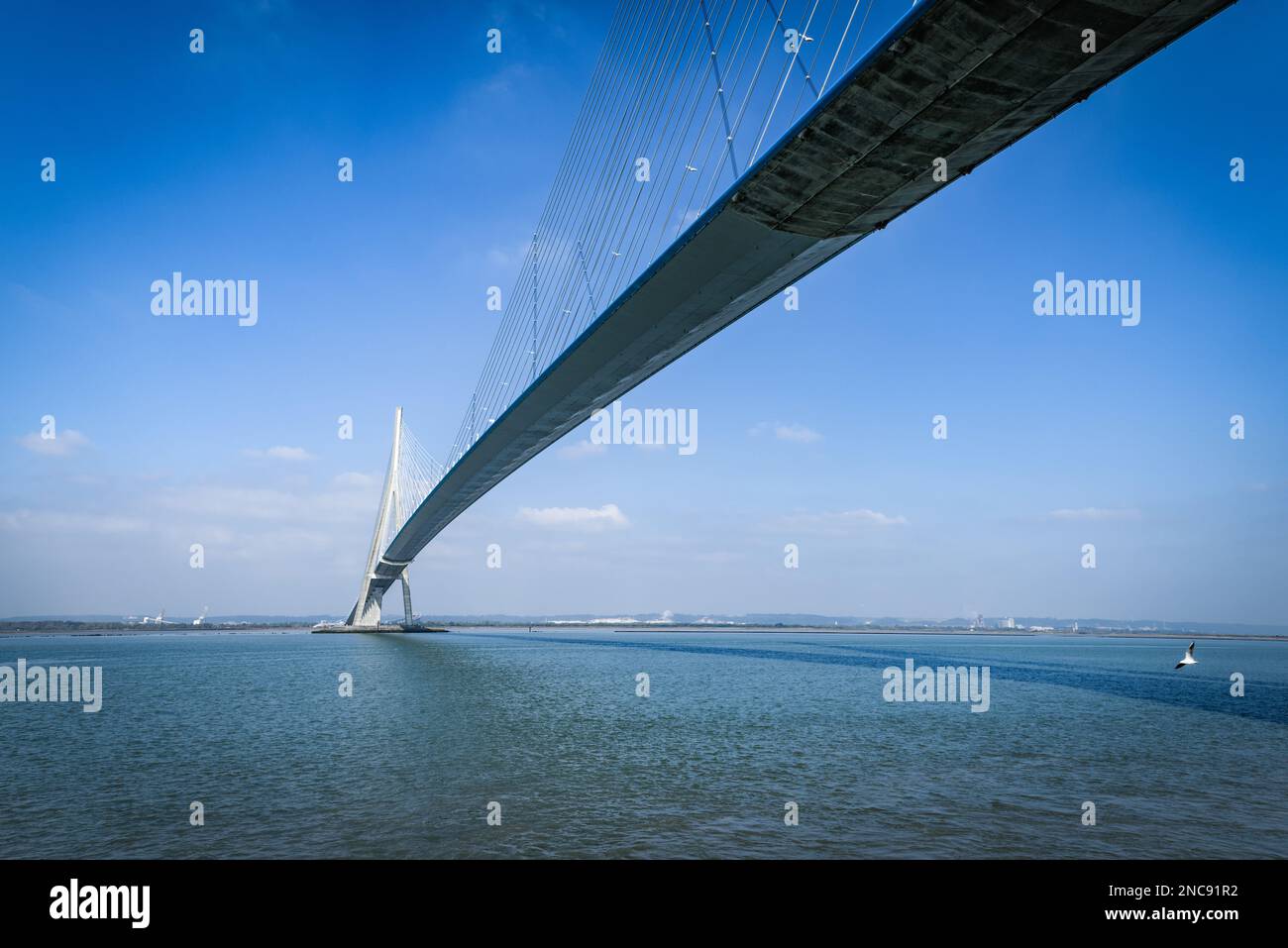 pillar of the bridge 'Pont de Normandie' reflected in the Seine river at Le Havre, France Stock Photo