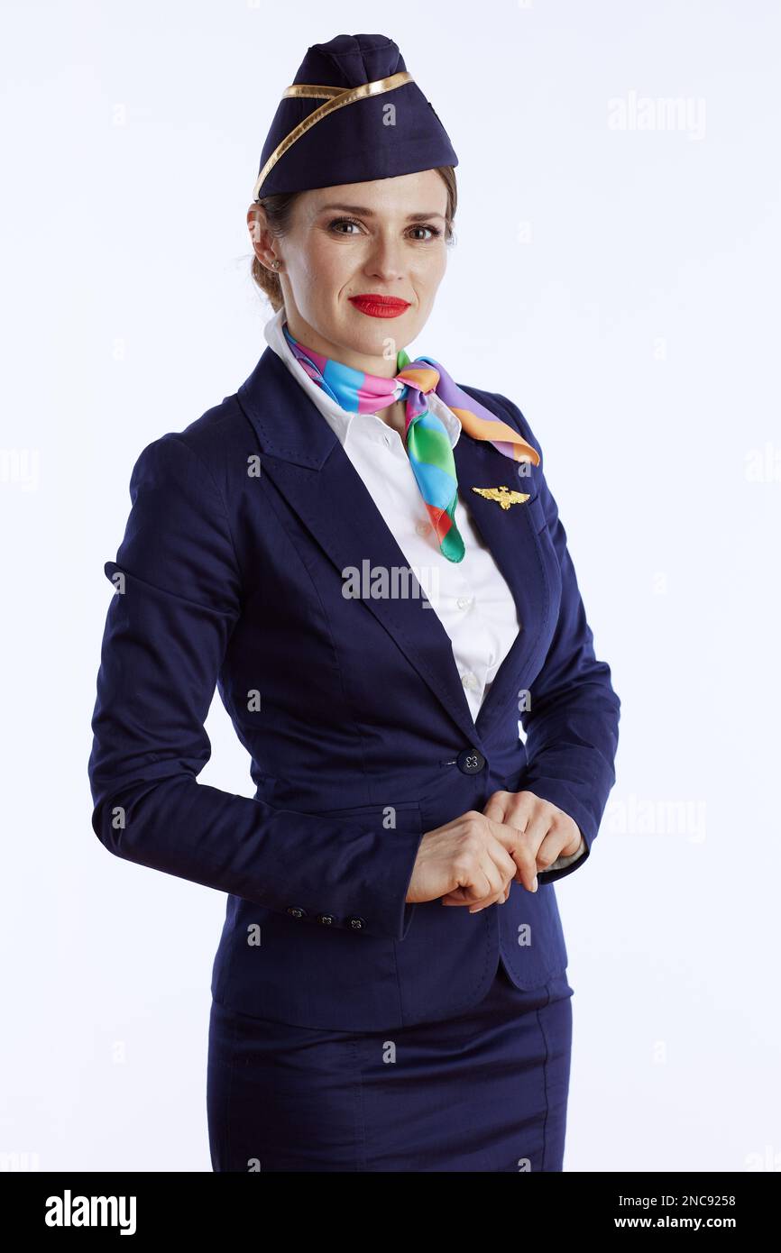 elegant air hostess woman against white background in uniform. Stock Photo