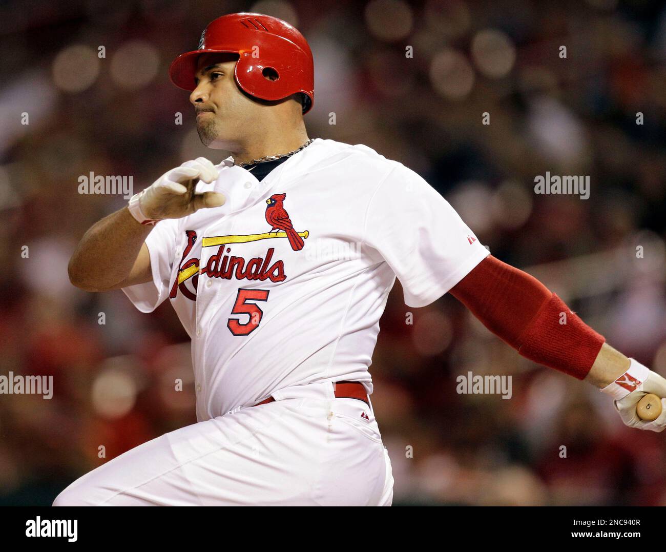 FILE - This Sept. 30, 2010, file photo shows St. Louis Cardinals first  baseman Albert Pujols following through on an RBI double during the first  inning of a baseball game against the