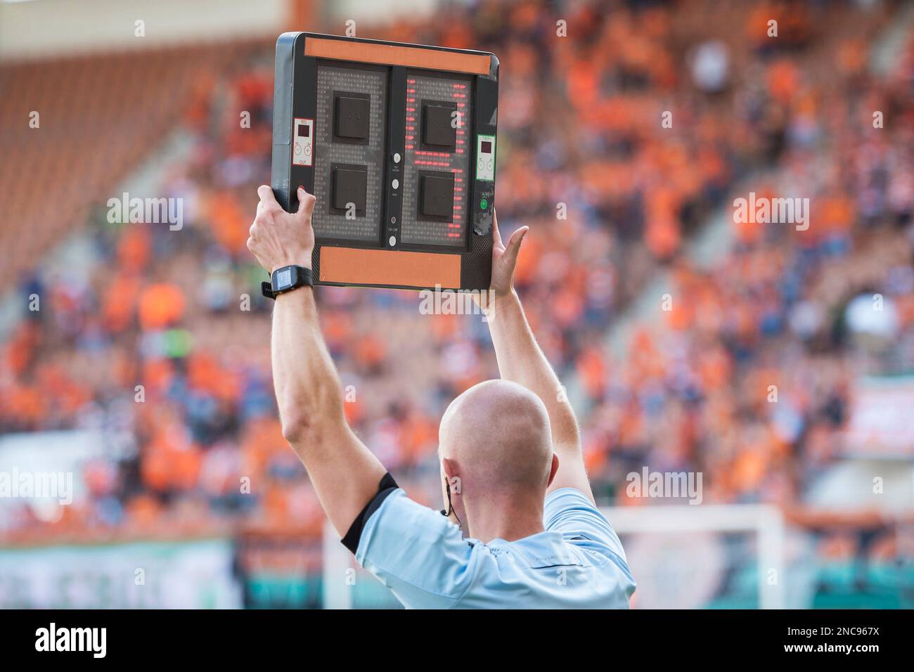 Technical referee shows 3 minutes added time during the football match