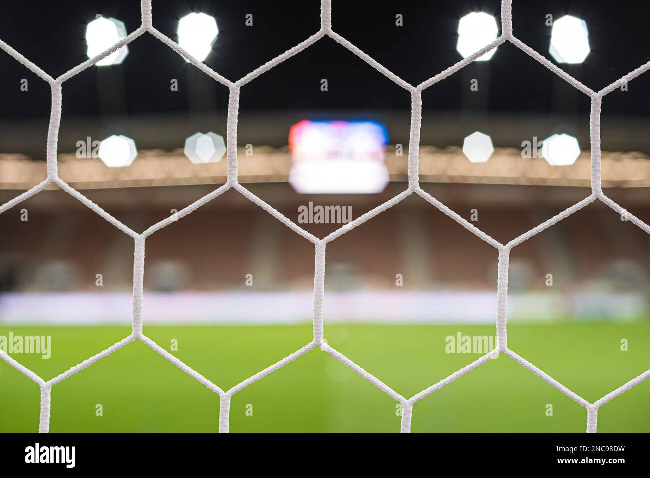Football stadium - view by the net Stock Photo
