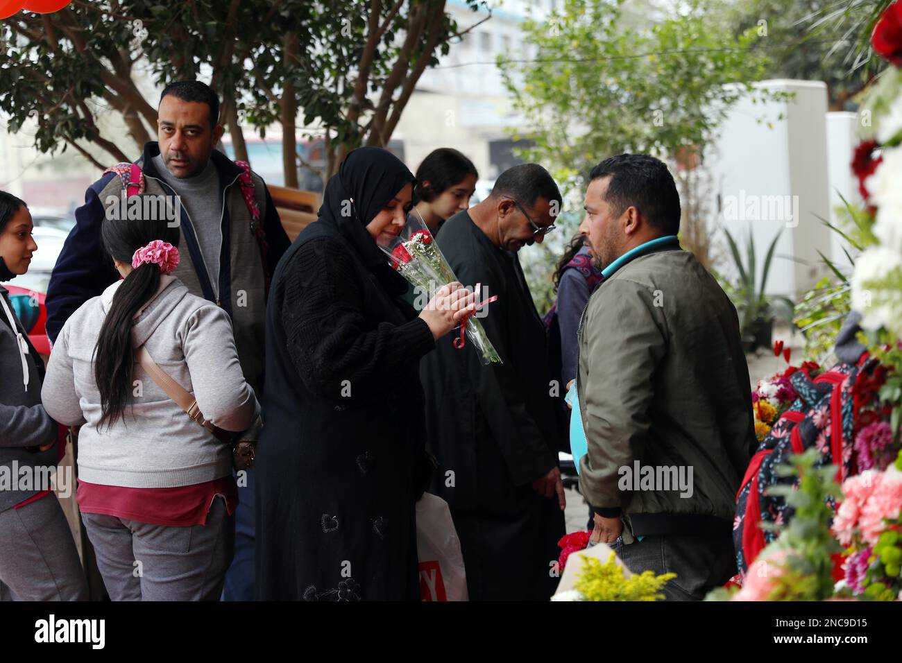 Cairo, Egypt. 14th Feb, 2023. A woman sniffs flowers on Valentine's Day