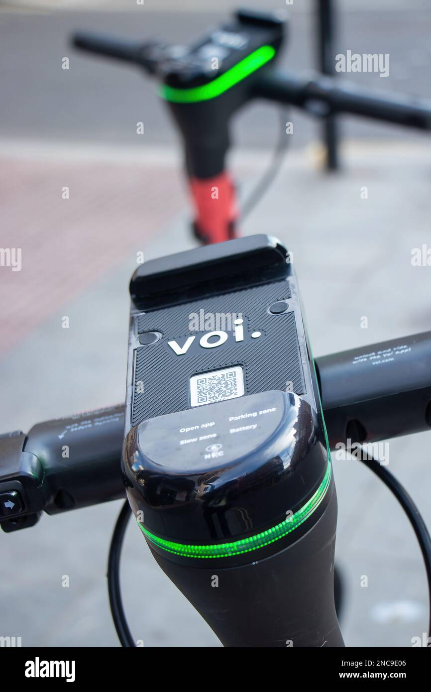 closeup of voi electric e scooter showing mobile phone app QR code
