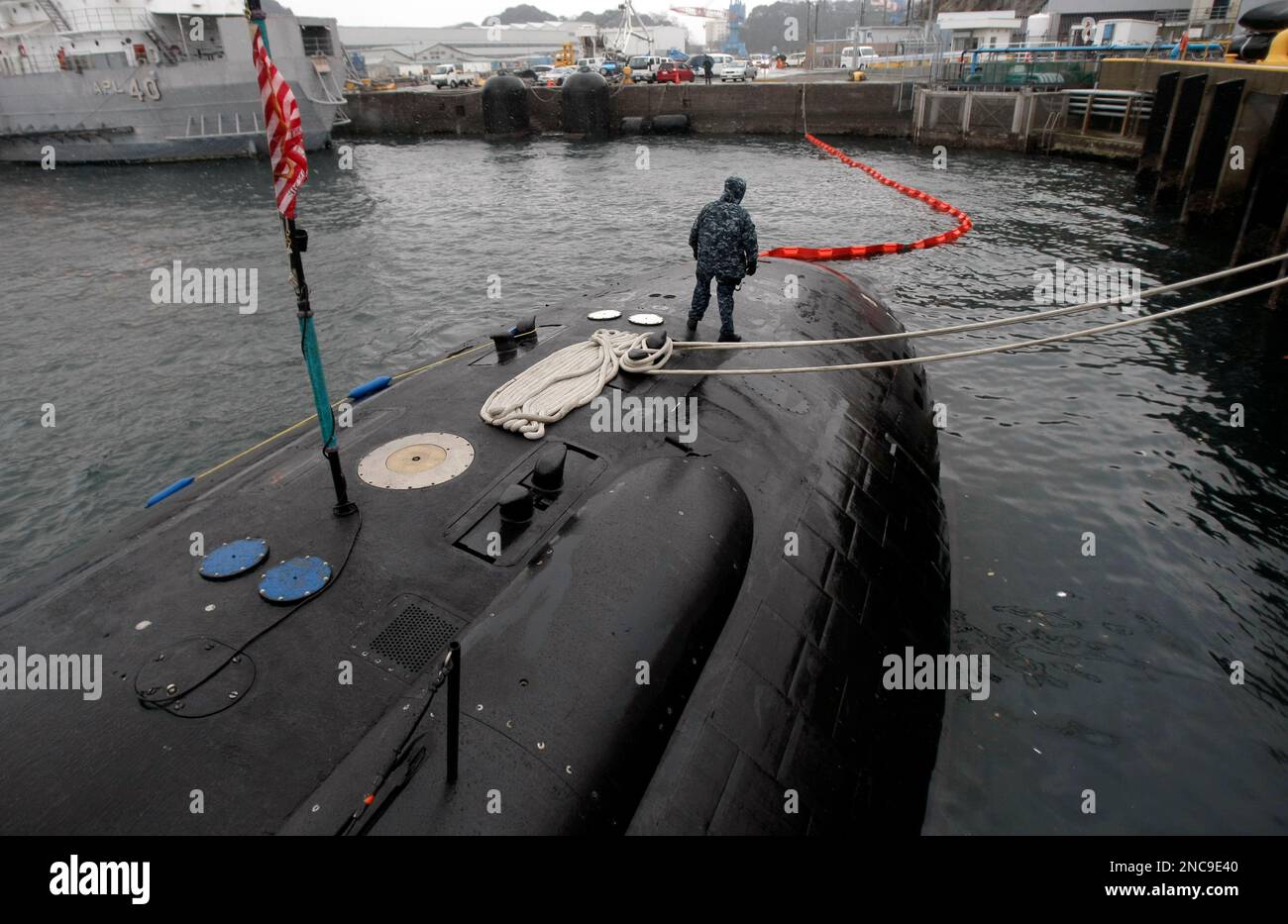 In this photo taken Friday, Feb. 11, 2011, a crew member patrols on the