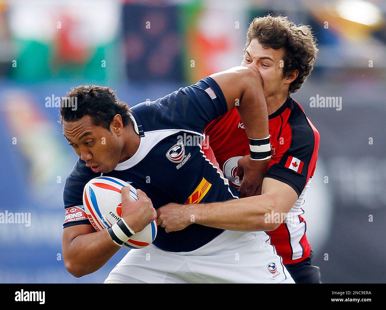 Canadas Taylor Paris tries to tackle Roland Suniula of the United States during the USA Sevens International Rugby Championships, broadcast on NBC Sports and Universal Sports from Sam Boyd Stadium on Sunday,