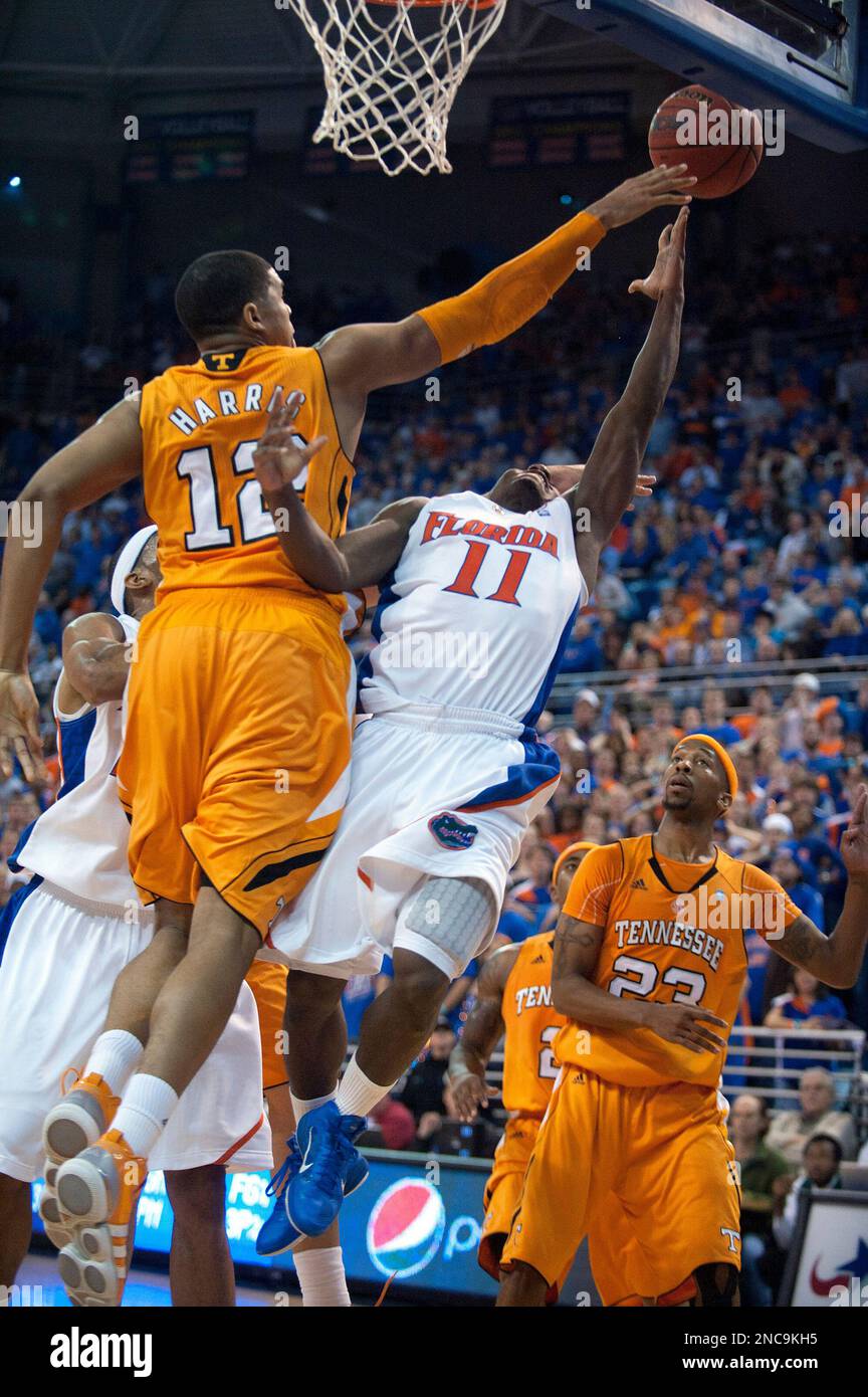 Florida guard Erving Walker (11) sinks the winning shot as Tennessee's  Tobias Harris (12) and Cameron Tatum (23) defend in an NCAA college  basketball game in Gainesville, Fla., Saturday, Feb. 12, 2011.