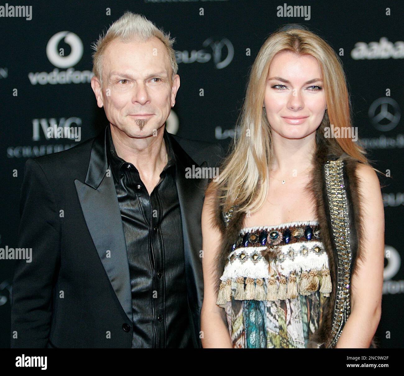 Scorpion's Lead Guitarist Rudolf Schenker left and his partner arrive for the Laureus Awards in