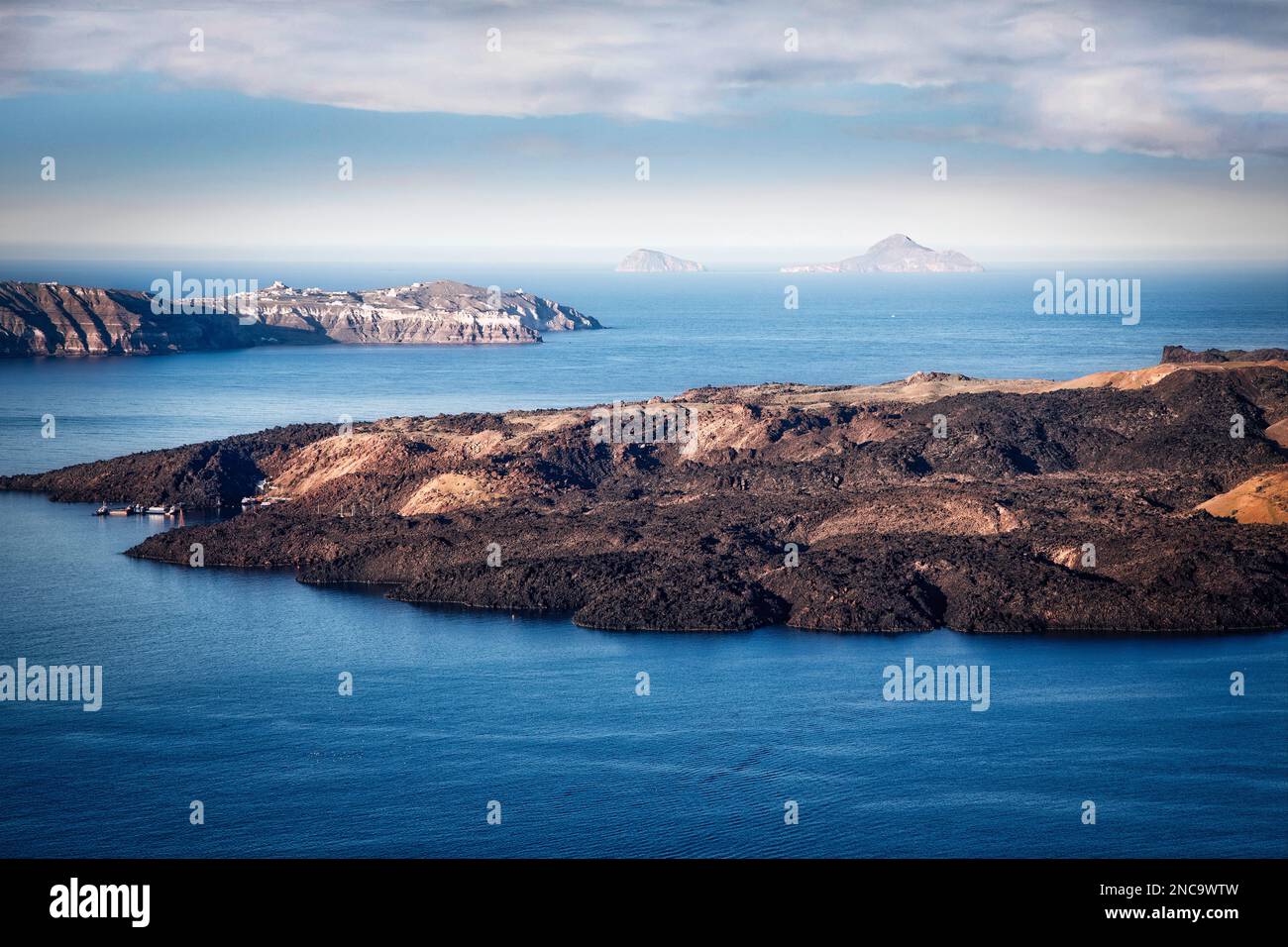 A view of the caldera at Santorini, Greece include the island of Nea Kameni. Stock Photo