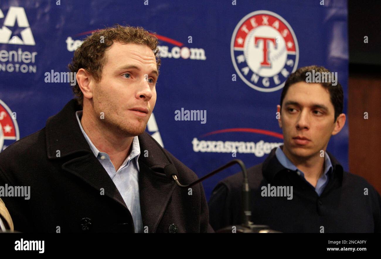 Texas Rangers' Josh Hamilton, left, and Esteban German rejoice