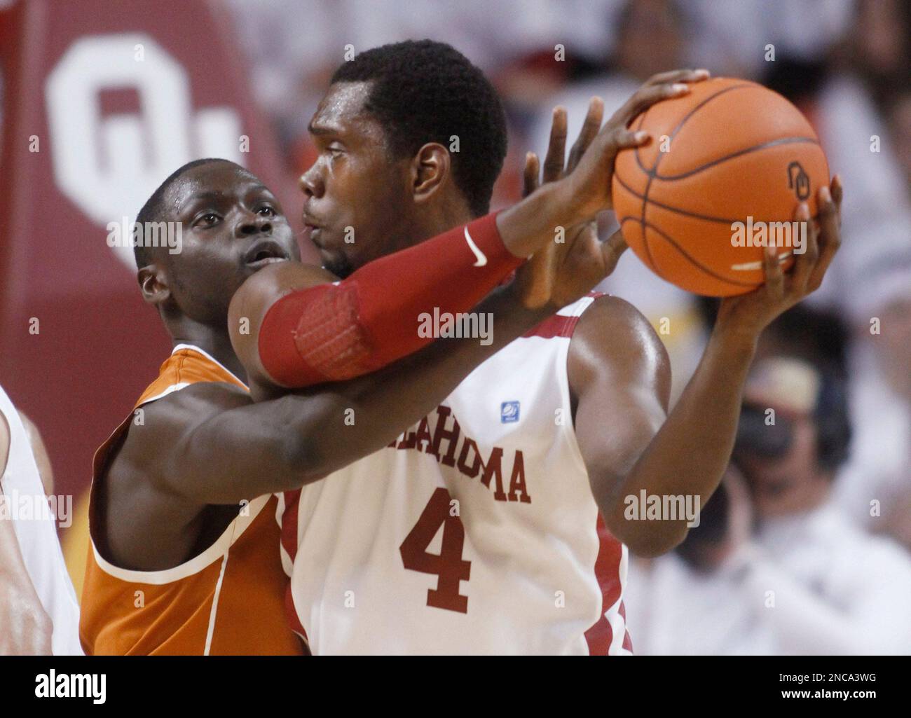 Texas forward Alexis Wangmene, left, tries to knock the ball away from