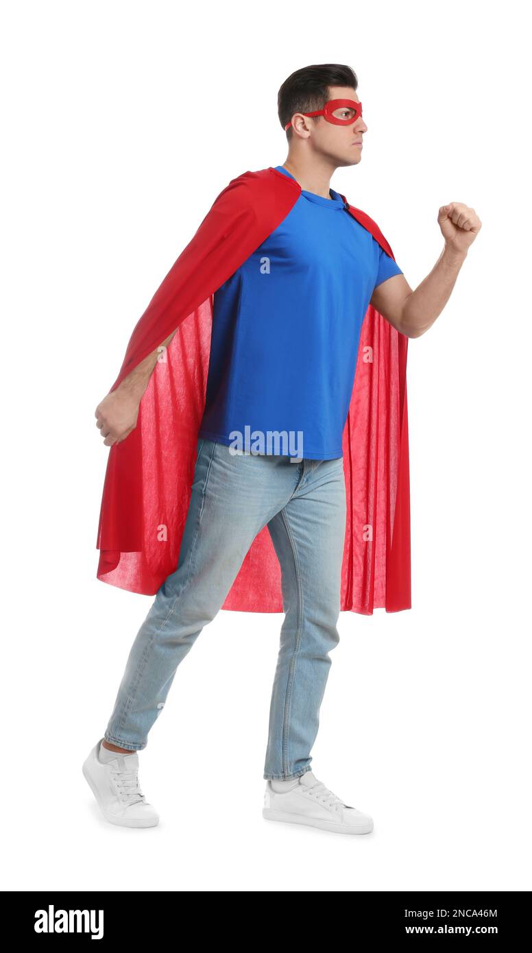 Man wearing superhero cape and mask on white background Stock Photo