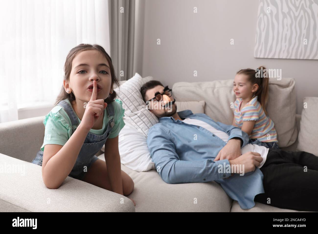 Cute Little Children Putting Funny Glasses On Father While He Sleeping cute-little-children-putting-funny-glasses-on-father-while-he-sleeping