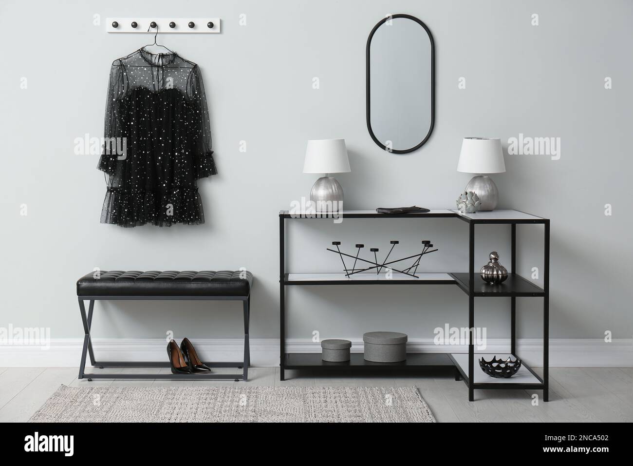 Modern hallway with stylish furniture, clothes and accessories ...