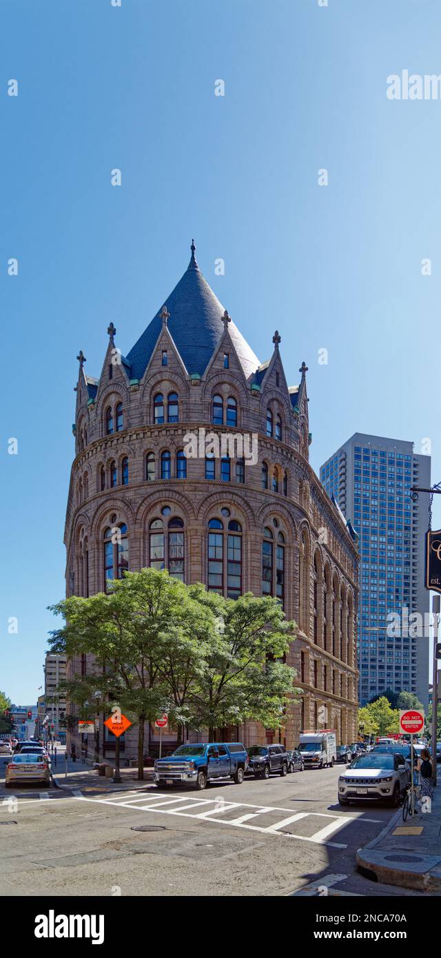 Boston landmark Grain Exchange Building opened in 1893. The former Chamber of Commerce Building has a pink granite façade, with Romanesque styling. Stock Photo