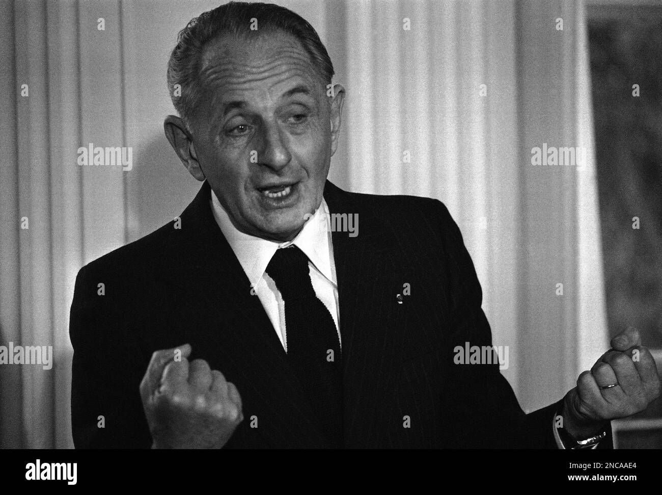 General Marcel Bigeard, known as Bruno, Secretary for the Ministry of Defense in France speaks at an Anglo-American press conference lunch on Jan. 13, 1976. (AP Photo/Michel Lipchitz) Stock Photo