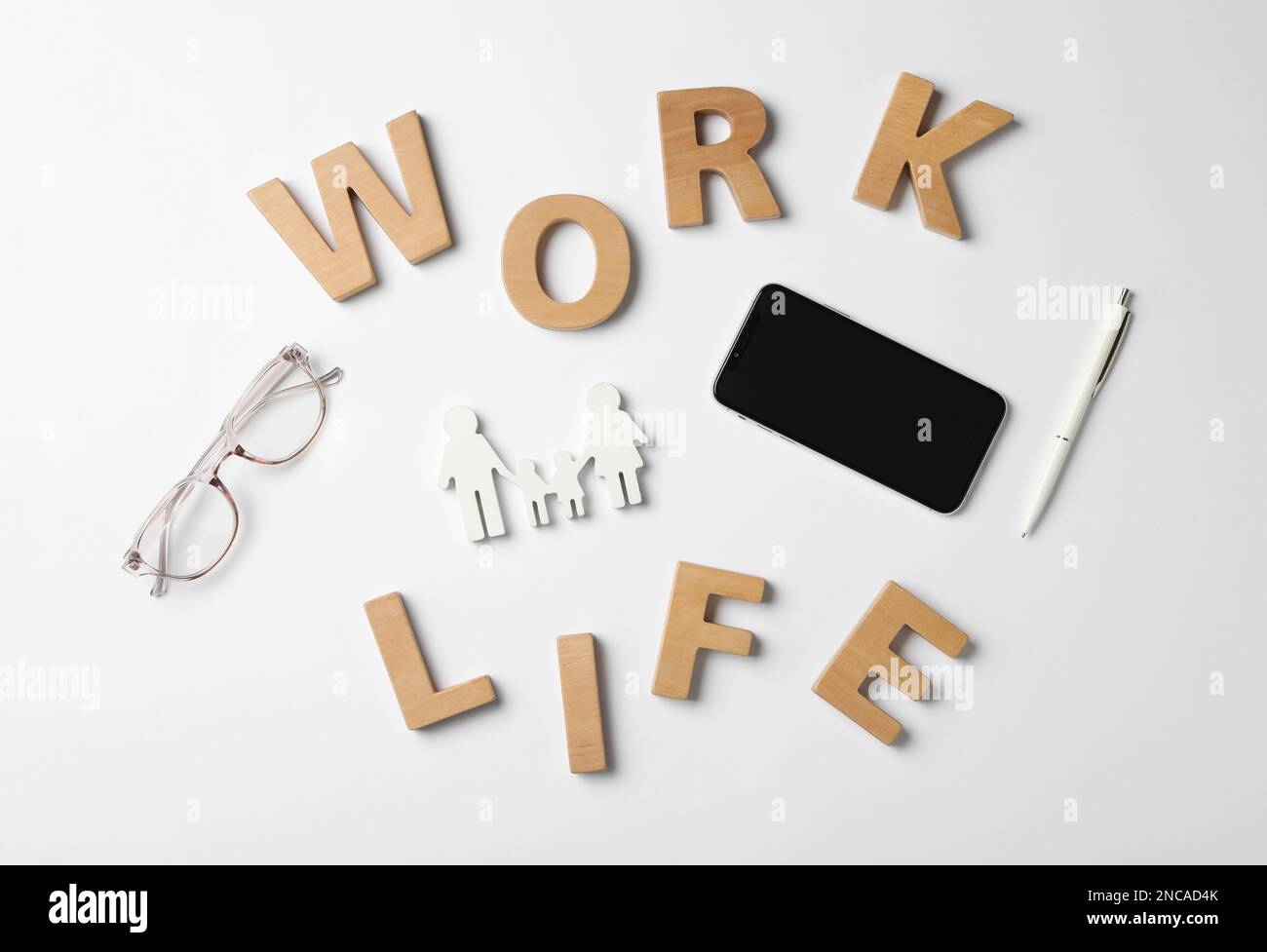Words Work, Life made with wooden letters, smartphone and eyeglasses on ...