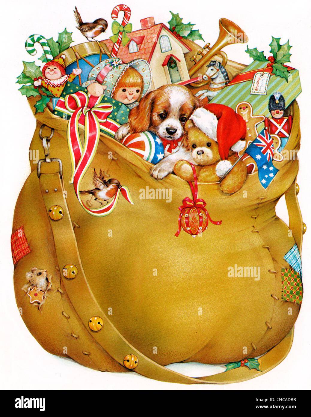 Christmas sack filled with toys, presents & puppy on white Stock Photo