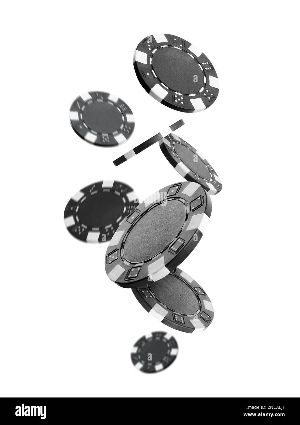 Black casino chips falling on white background Stock Photo Alamy