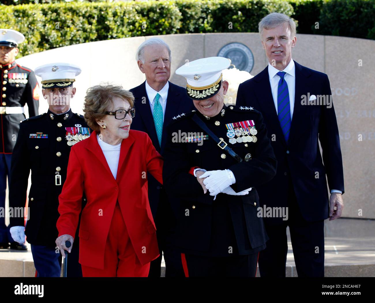 Former first lady Nancy Reagan is helped by Marine Lt. Gen. George J ...