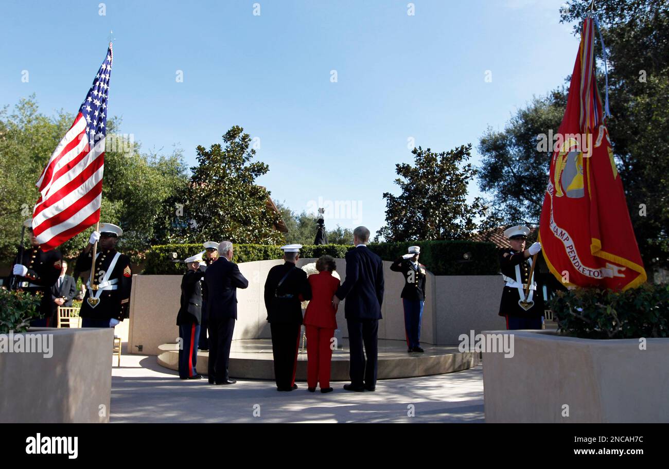 Former first lady Nancy Reagan is helped by Marine Lt. Gen. George J ...