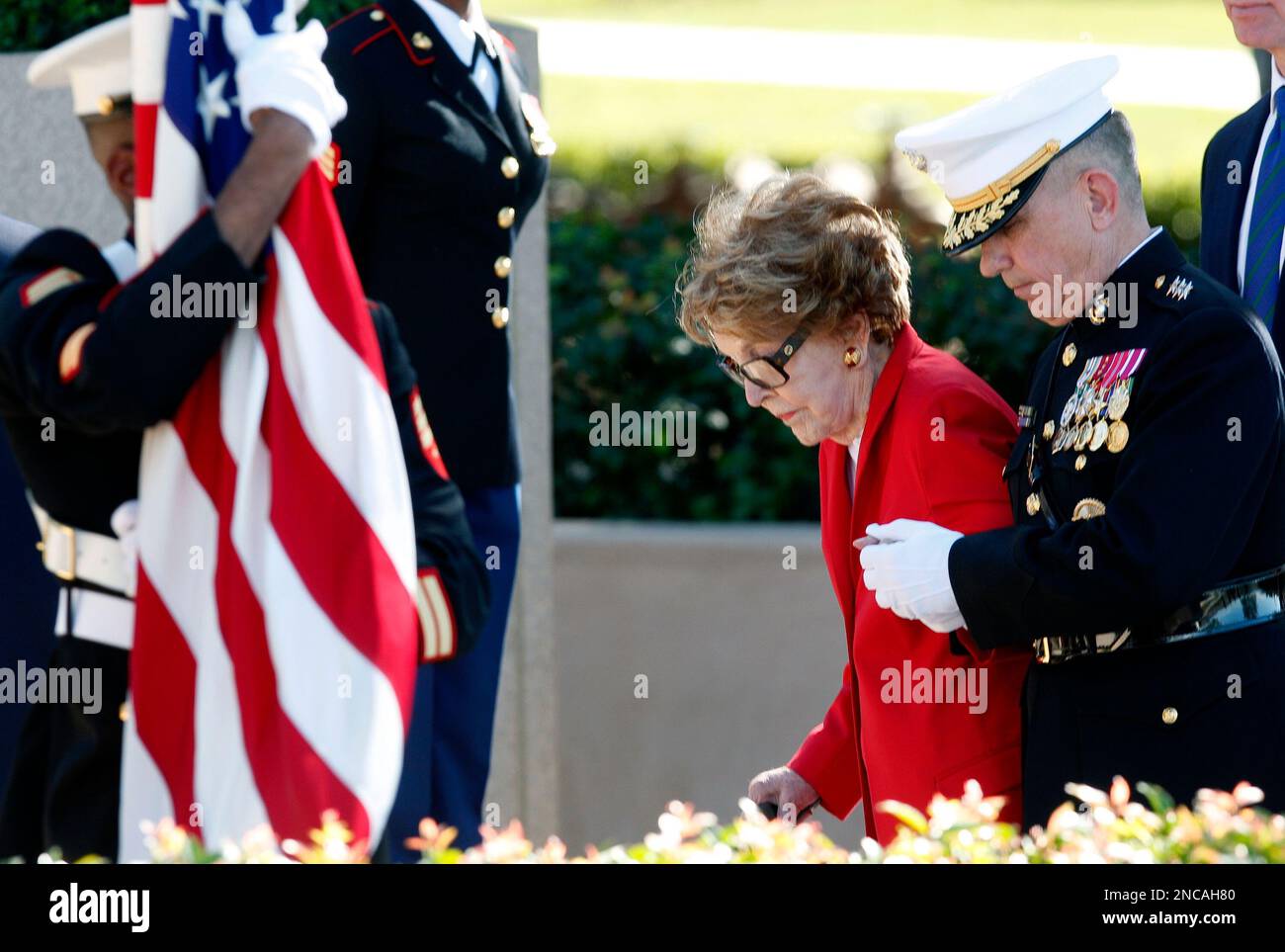 Former first lady Nancy Reagan is helped by U.S. Marine Lt. Gen. George ...