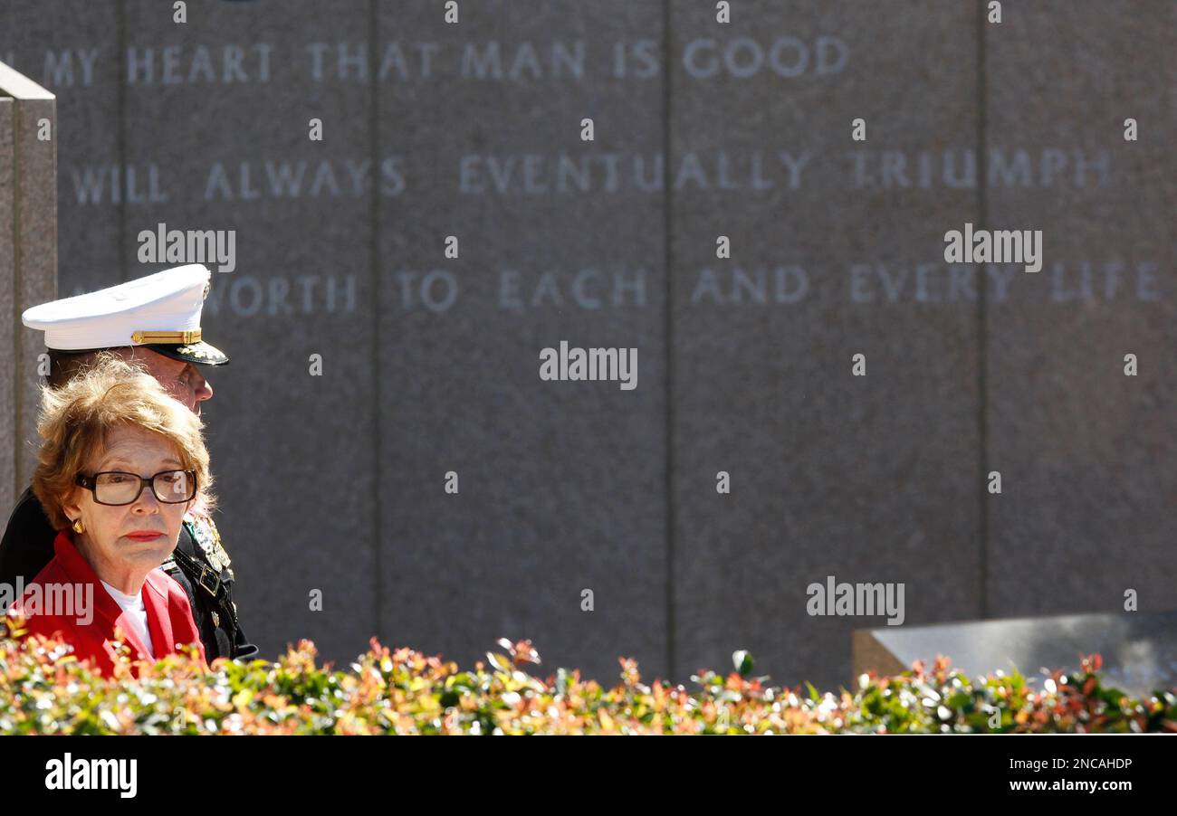 Former first lady Nancy Reagan sits by the memorial for her husband ...