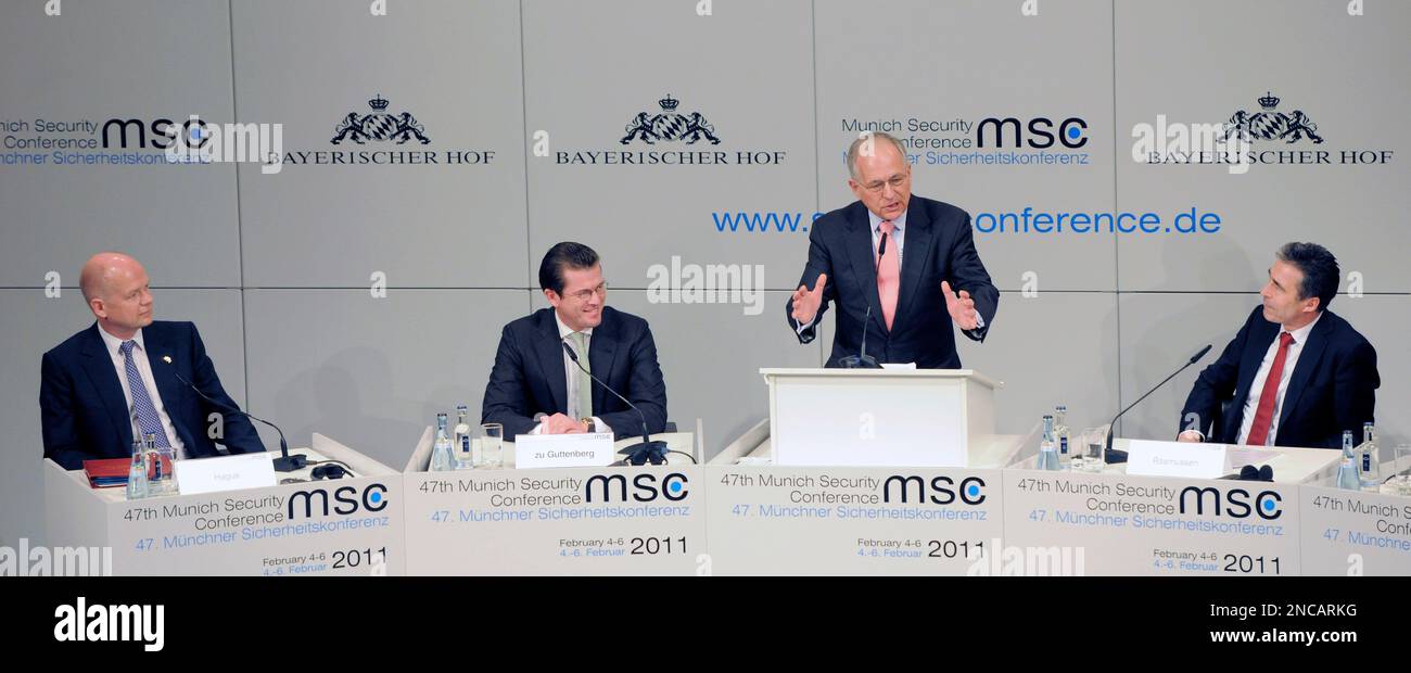 Munich Security Conference Chairman Wolfgang Ischinger, second right, gestures besides German Defense Minister Karl-Theodor zu Guttenberg, 2nd left, Britain's Foreign Minister William Hague, left, and NATO Secretary General Anders Fogh Rasmussen, right, during the opening of the Conference on Security Policy in Munich, Germany, Friday, Feb. 4, 2011. (AP Photo/Jens Meyer) Stock Photo