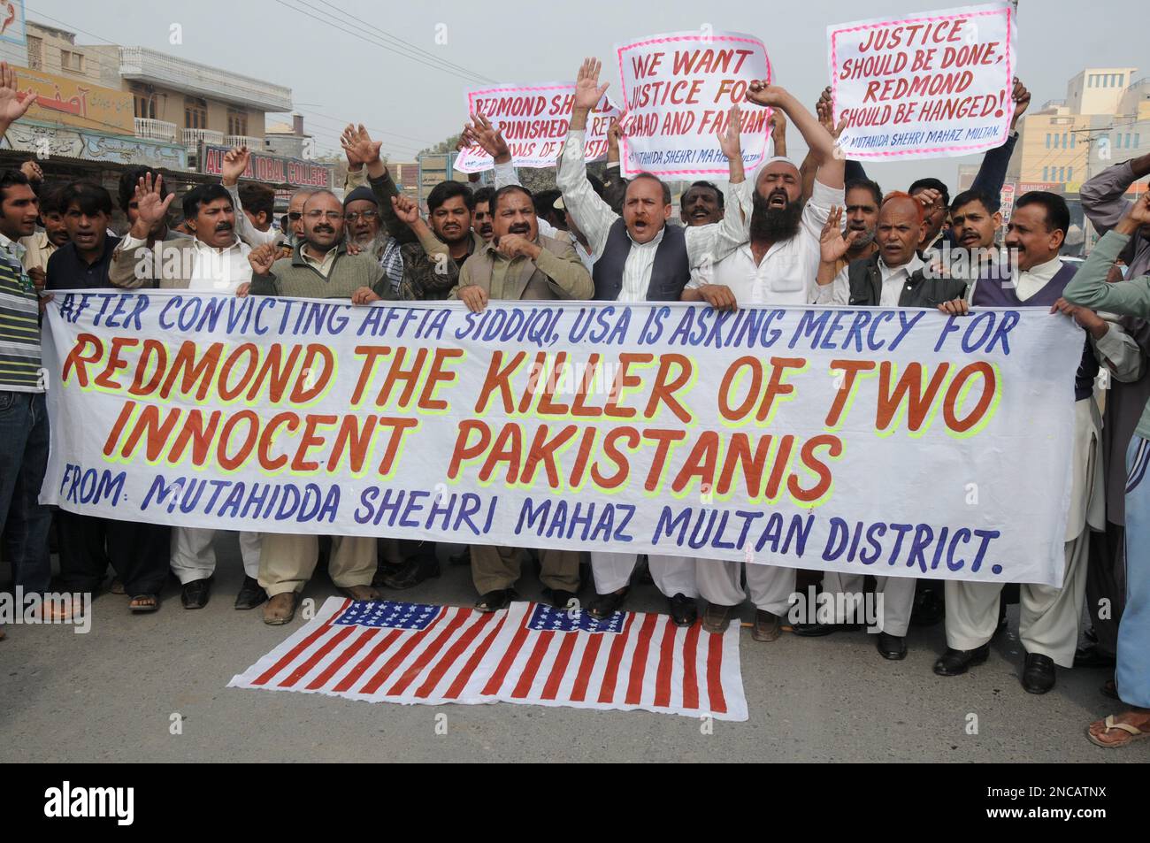 Pakistani protesters rally against a U.S. consular employee, suspected
