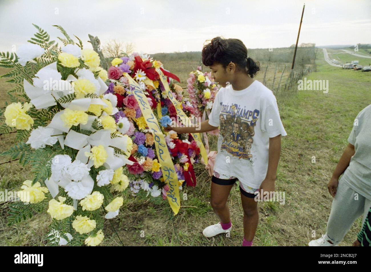 Hayneville High School student Paula Pringle removes a flower from a